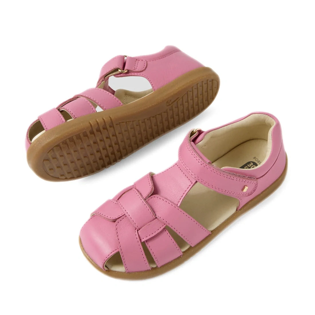 A pair of Bobux Kids Plus KP Skip Twist Cashmere Rose Pink Closed Toe Sandals, designed for kids’ summer wear, featuring woven leather straps and tan rubber soles, displayed from side and top views., 9420074848390, 9420074848406, 9420074848413, 9420074848