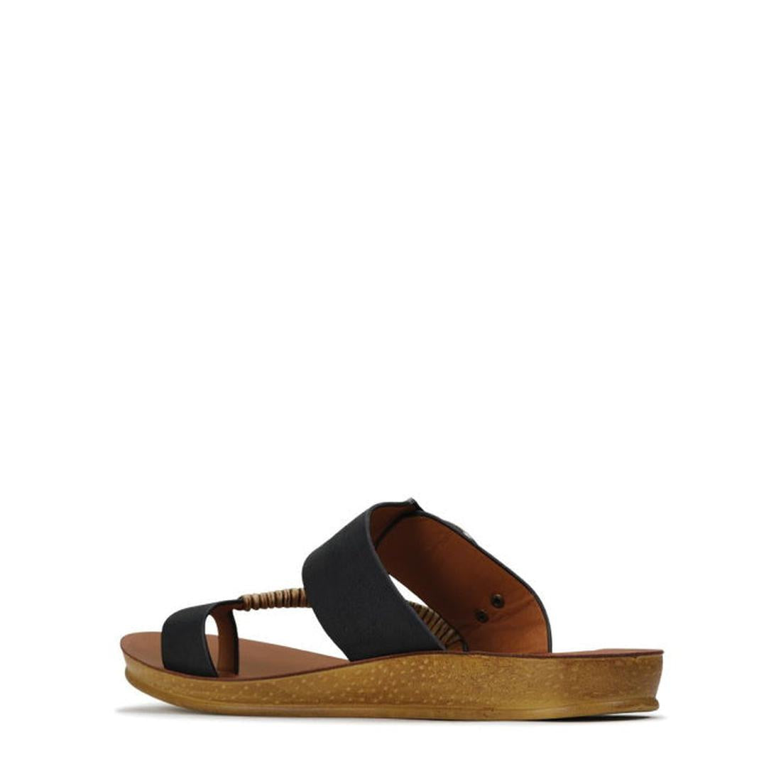 A side view of the Los Cabos Bria Black Light Flexible Sandal Jandal, featuring a brown sole, black crisscross straps with woven detail near the front, and an open heel. The white background highlights this perfect summer sandal., 9321191053158, 932119105