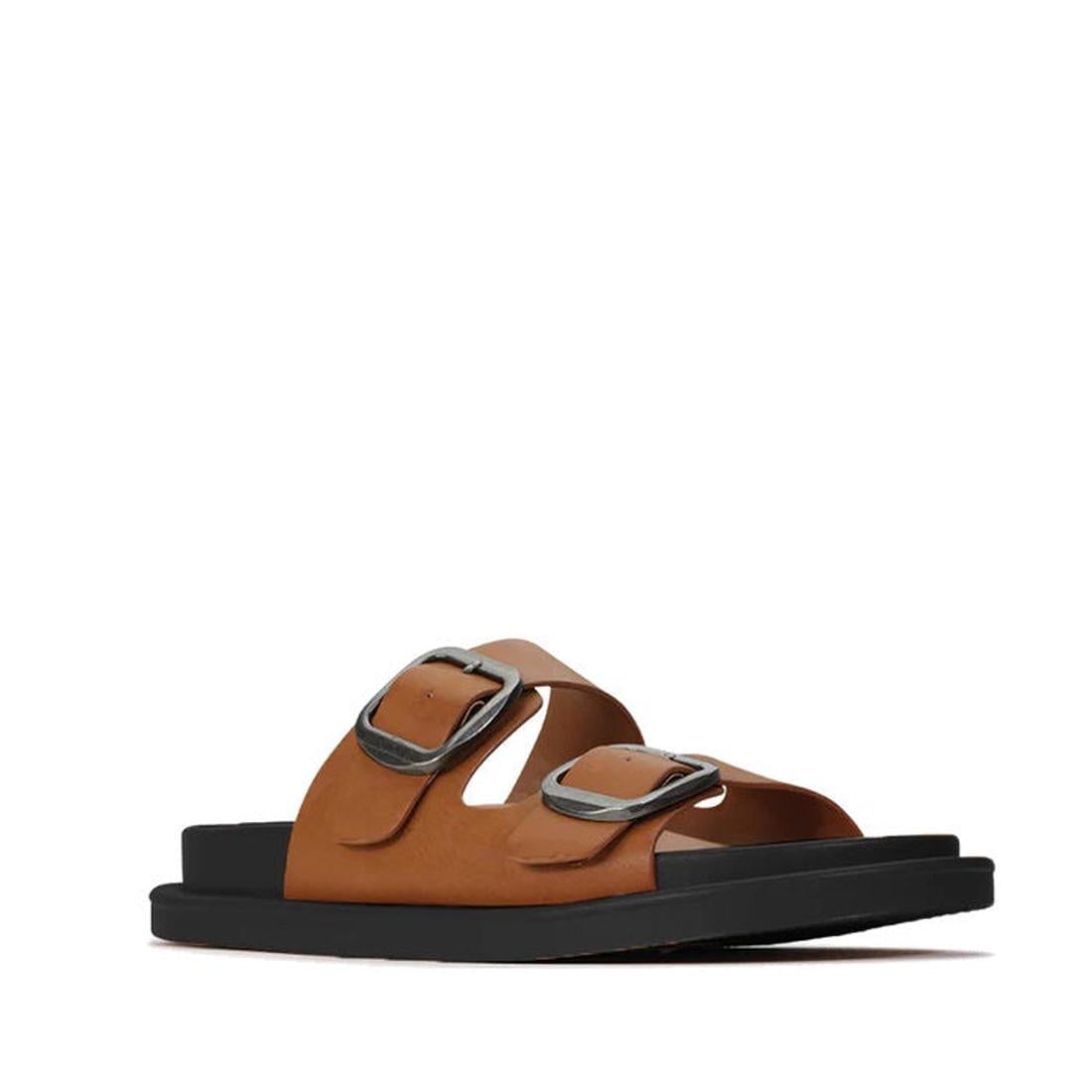 The Los Cabos Womens Slide Ando with Arch Support in Brandy features two wide brown straps with large silver buckles on a thick black sole and cushioned footbed, photographed on a plain white background.