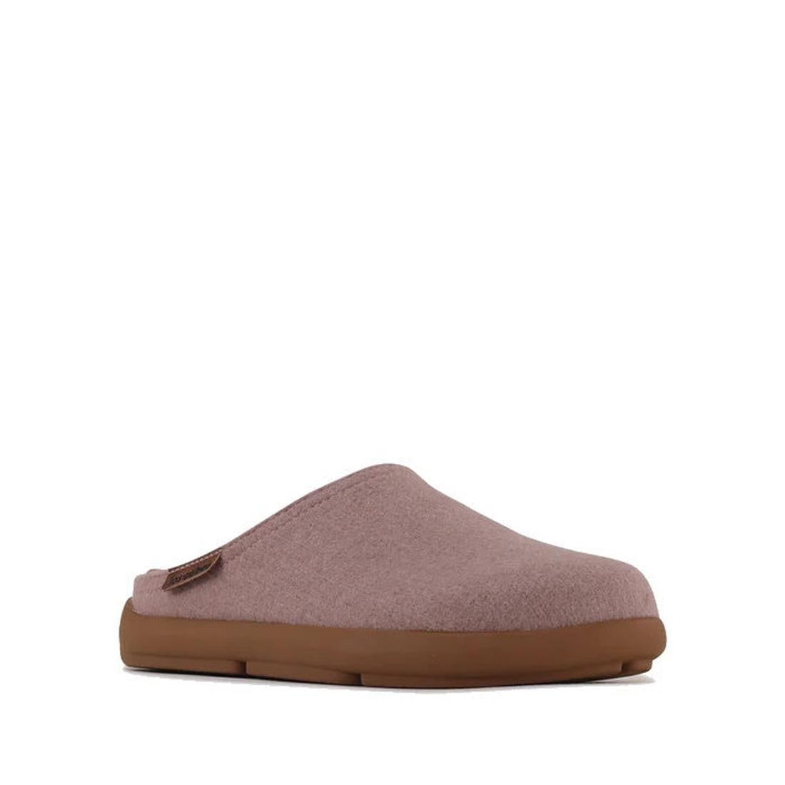 The Los Cabos Felton Graphic Lavender Women's Felted Slipper House is a mauve slip-on with a soft fabric upper and cushioned sole, ideal for cozy slipper lovers, shown against a white background.