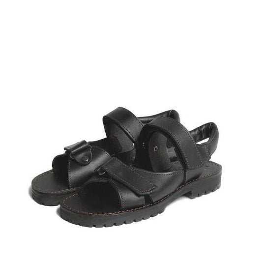 The Mckinlays Safari Black School Sandal (sizes 35-42) features durable NZ-made black leather, adjustable Velcro straps, and rugged rubber soles—shown side by side on a white background, perfect for schoolwear.