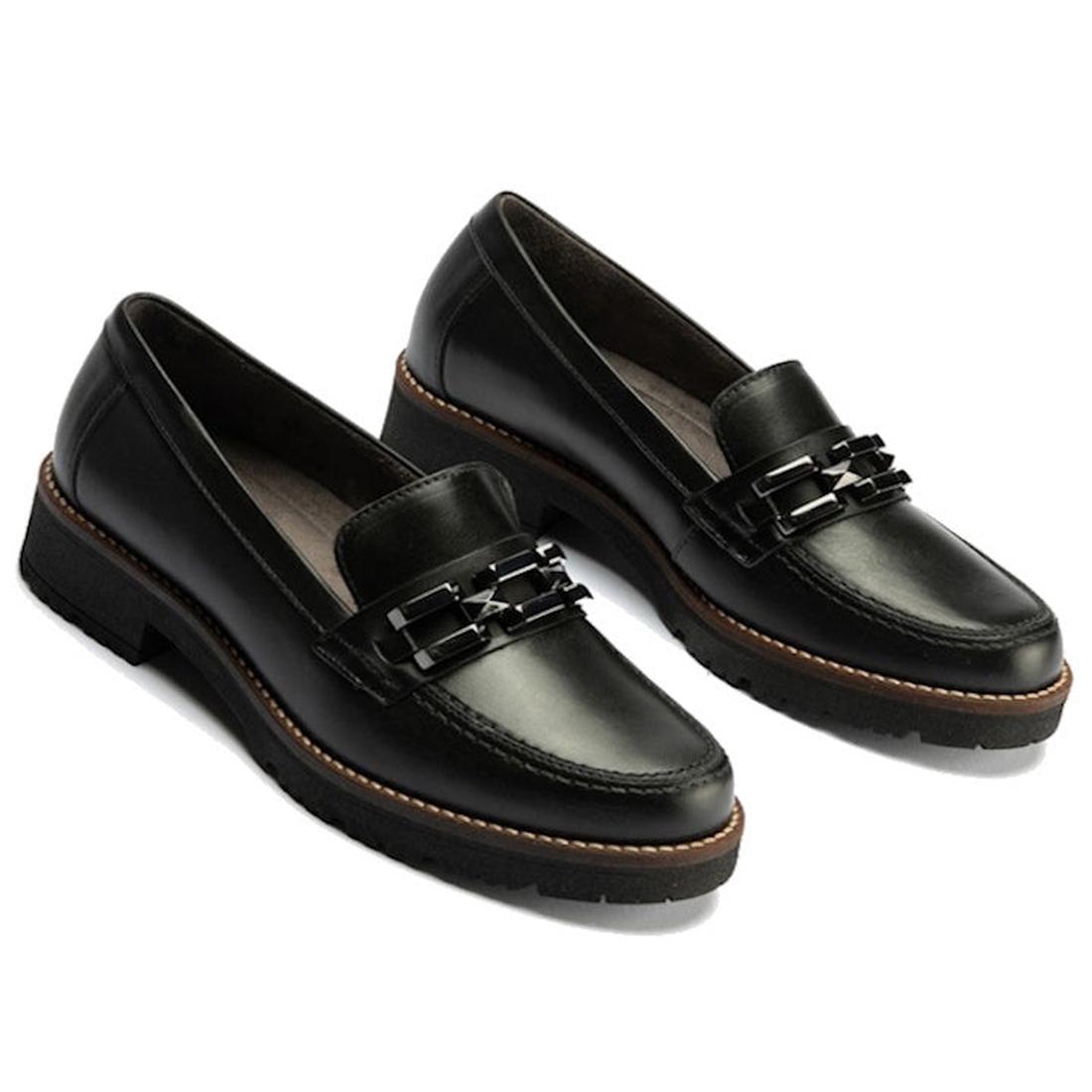 The Pitillos Womens Chunky Slip On Loafer Black Nappa Leather 10775 is a black leather loafer made in Spain, with a low chunky heel, brown stitching around the sole, and decorative black chain detail on the front.