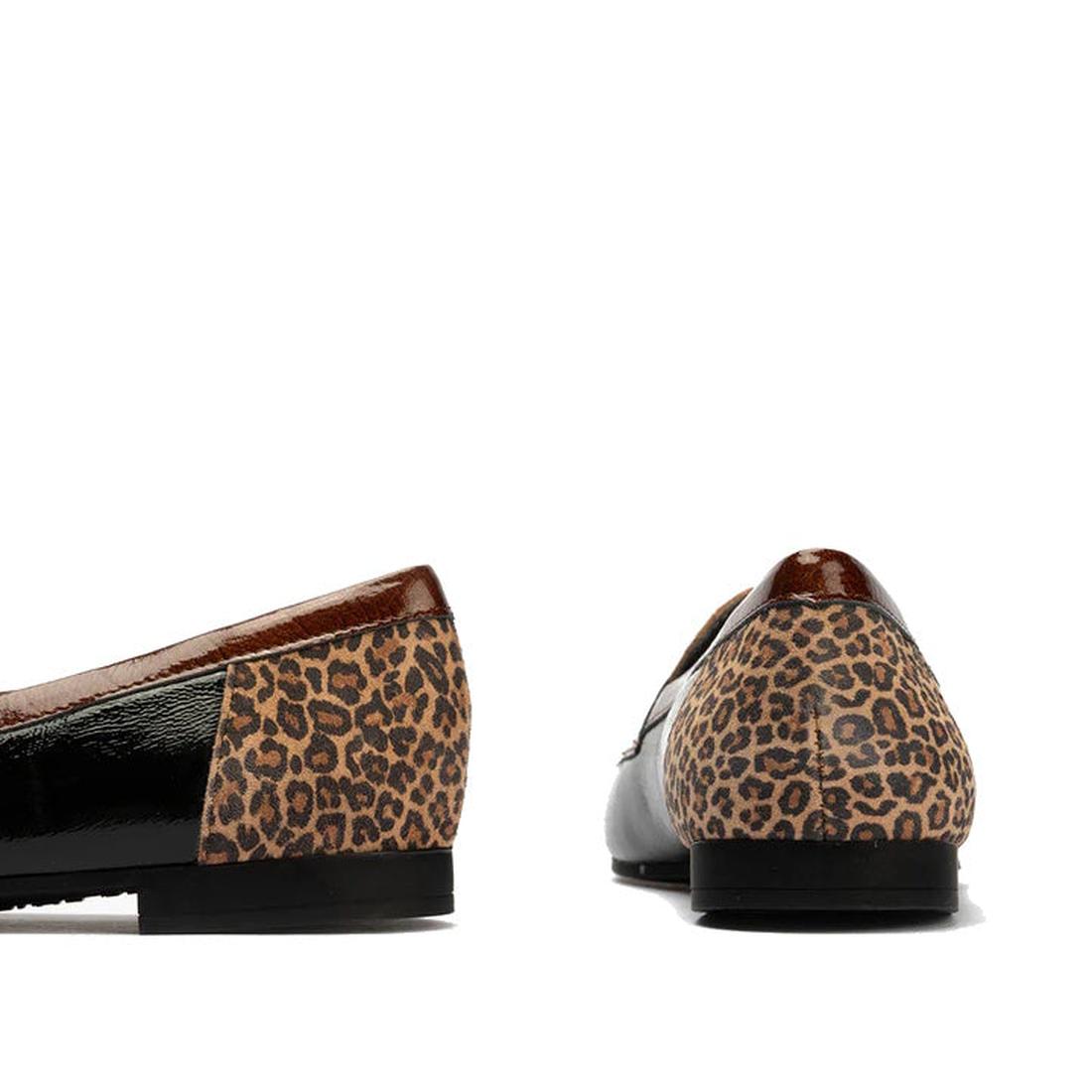 The Pitillos Womens Black Flat Patent Loafer Moccasin 10870 features black patent leather, brown trim, and a chic leopard accent on the heel, displayed from side and back angles against a white background., 8445191690432, 8445191690449, 8445191690456, 844