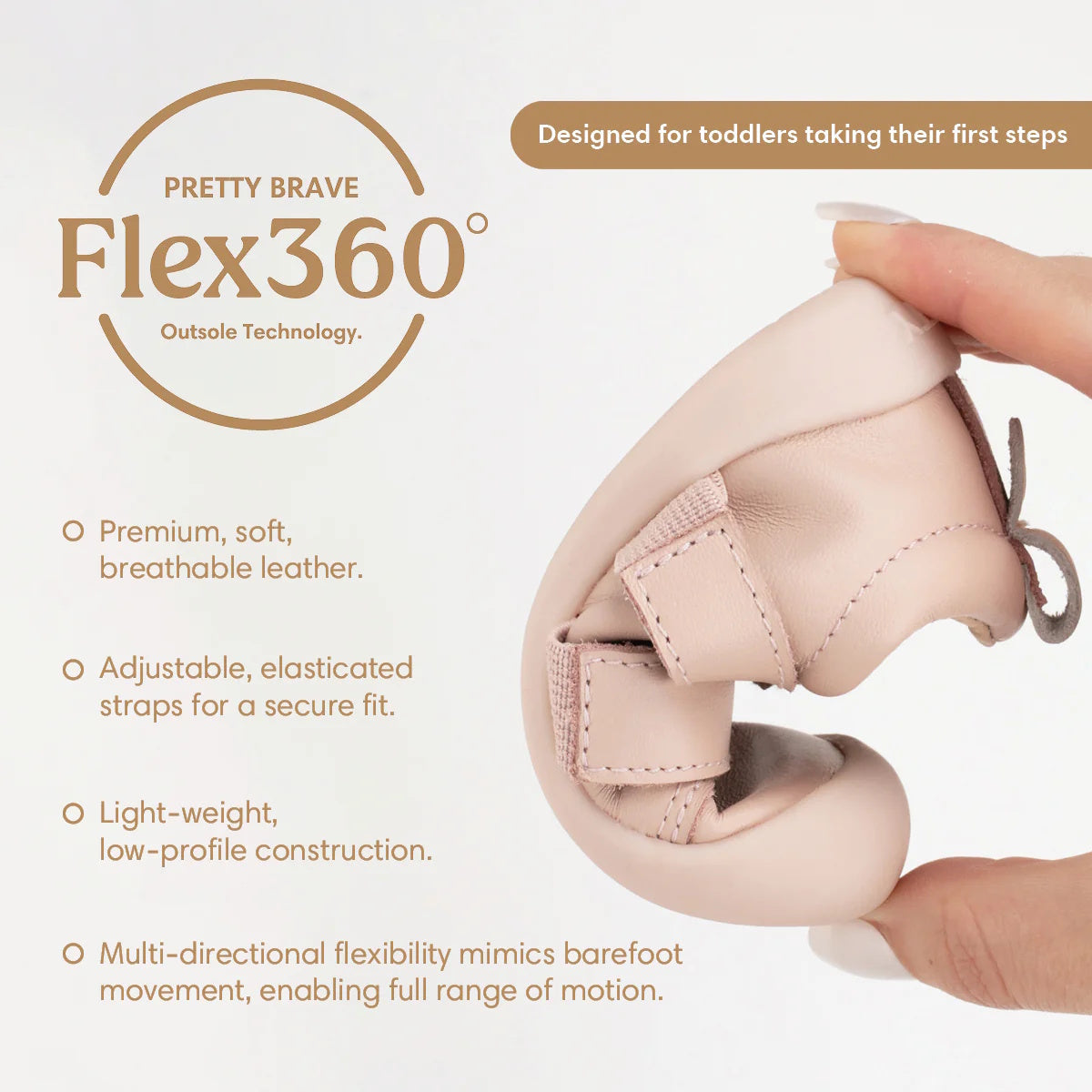 A hand bends the Pretty Brave First Walker Toto Leather Trainer in Dusky Pink, showing its flexible sole. Features include premium breathable leather, adjustable straps, lightweight design, and multi-directional flexibility for little ones’ first steps., 