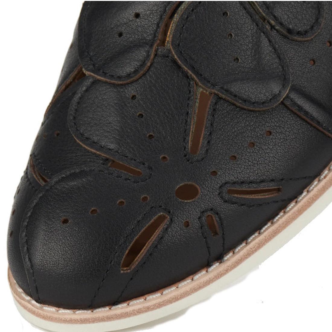 Close-up of the Rollie Derby Applique Black Womens Leather Brogue Shoe—Australian designed in black leather with floral cutout patterns, decorative upper perforations, and a light-toned stitched sole., 9781760792312, 9781760792329, 9781760792336, 97817607