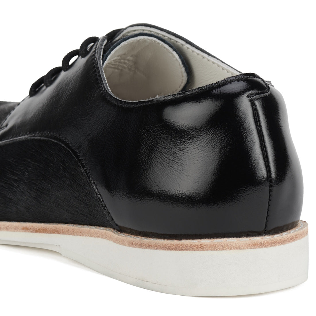 Close-up of the Rollie Womens Derby Black Splice Leather Brogue Shoe: black leather upper, white inner lining, thick white anti-slip rubber outsole, black laces, shiny finish, and a removable orthotic-friendly footbed for comfort., 51190, 9339554014920, 9