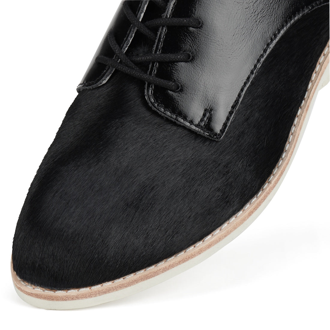 Close-up of the Rollie Womens Derby Black Splice Leather Brogue Shoe, showcasing smooth leather with a textured finish, anti-slip rubber outsole, black laces, and contrast stitching along the sole., 51190, 9339554014920, 9339554054292, 9339554007458, 9339