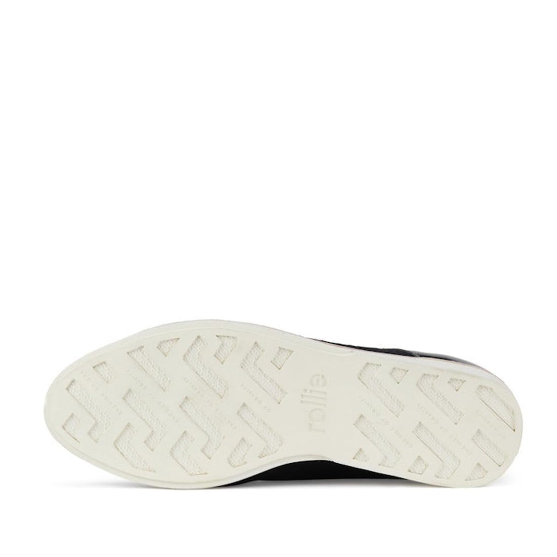 The image displays the white anti-slip rubber outsole of the Rollie Womens Derby Black Splice Leather Brogue Shoe, featuring a zigzag and geometric texture with "rollie" embossed near the arch. The background is white., 51190, 9339554014920, 9339554054292