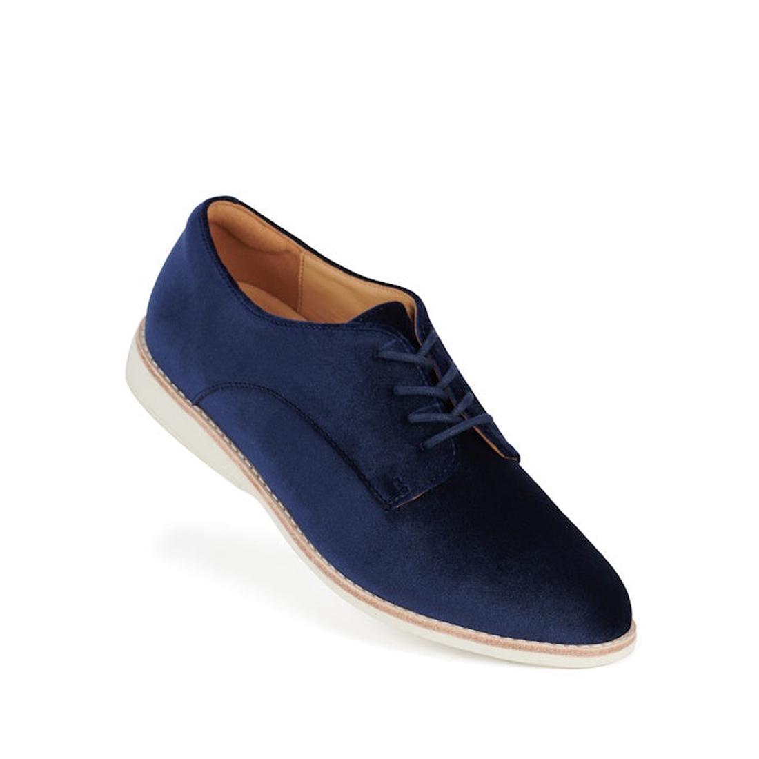 The Rollie Womens Derby Navy Velvet Brouge Shoe is a single navy blue velvet lace-up dress shoe with a tan interior lining and a white sole, displayed against a plain white background.