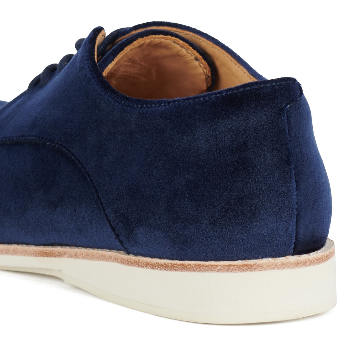 Close-up of the heel and side of a Rollie Womens Derby Navy Velvet Brouge Shoe with a tan leather lining and white sole, shown against a white background., 9339554000046, 9339554035741, 9339554028743, 9339554006123, 9339554009810