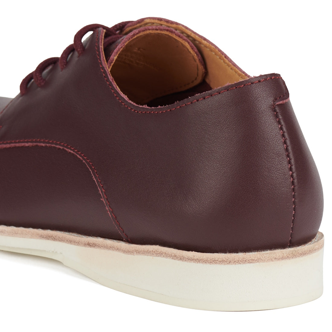Close-up of the Rollie Womens Derby Super Soft Dark Cherry Leather Shoe, highlighting the smooth leather heel and side, light stitching, cushy EVA midsole, white anti-slip rubber outsole, and part of the open collar., 9339554034843, 9339554086330, 9339554