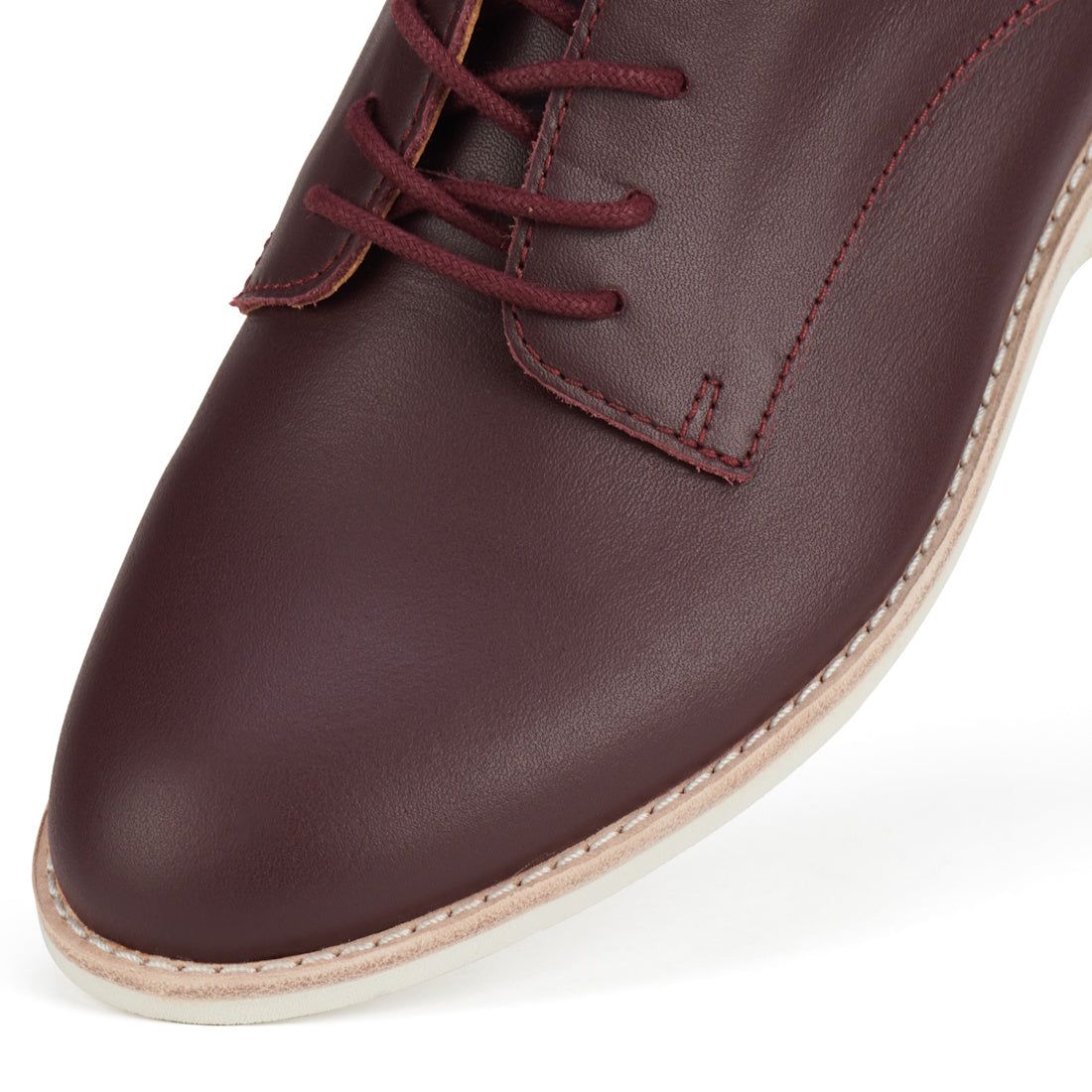 Close-up of the Rollie Womens Derby Super Soft Dark Cherry Leather Shoe, featuring matching dark red laces, red stitching, and a cream rubber sole with an anti-slip outsole against a white background., 9339554034843, 9339554086330, 9339554099231, 93395540