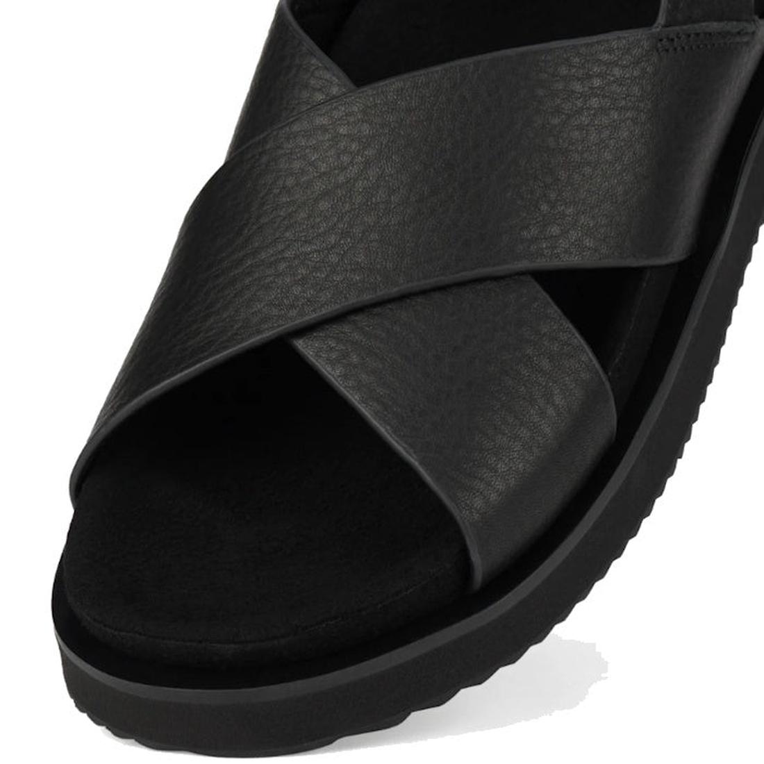 A close-up angled top view of the Rollie Womens Rhodes Cross Sandal in Tumble Black Leather with crisscross straps, back strap, leather upper, and textured sole., 48159, 9781760793692, 9781760793708, 9781760793715, 9781760793722, 9781760793739, 9781760793
