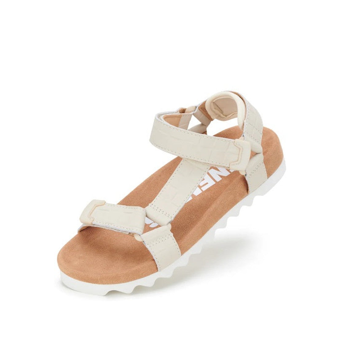 The Rollie Womens Sandal Tooth Wedge Bone Croc features adjustable beige leather straps, a cushioned tan suede-wrapped footbed, and a white EVA sawtooth wedge outsole, shown at an angle on a white background.