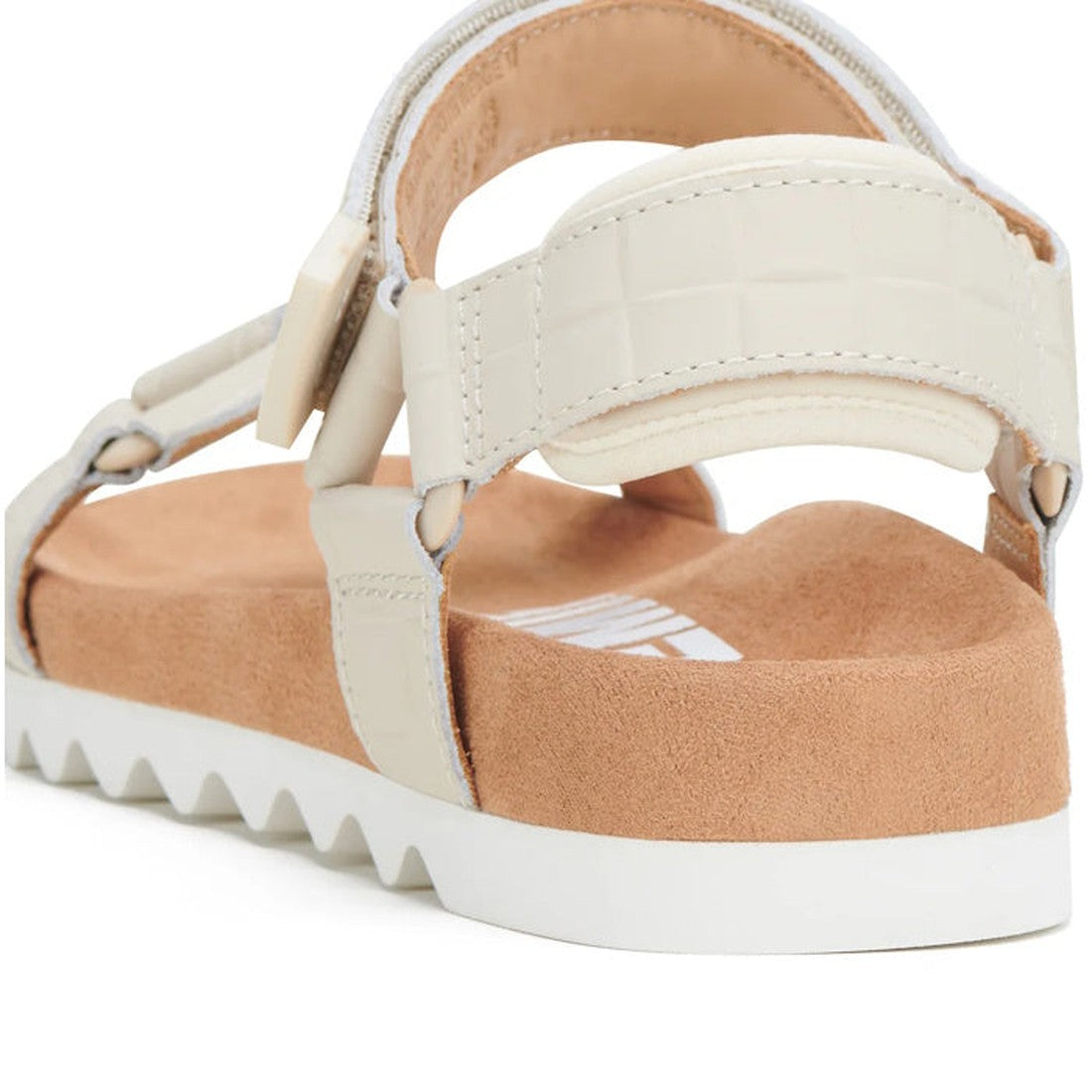 A close-up of the Rollie Womens Sandal Tooth Wedge Bone Croc, showing adjustable beige sheep leather straps, a suede-wrapped footbed, and a white EVA sawtooth wedge outsole with a jagged tread pattern., 9781760775865, 9781760775872, 9781760775889, 9781760
