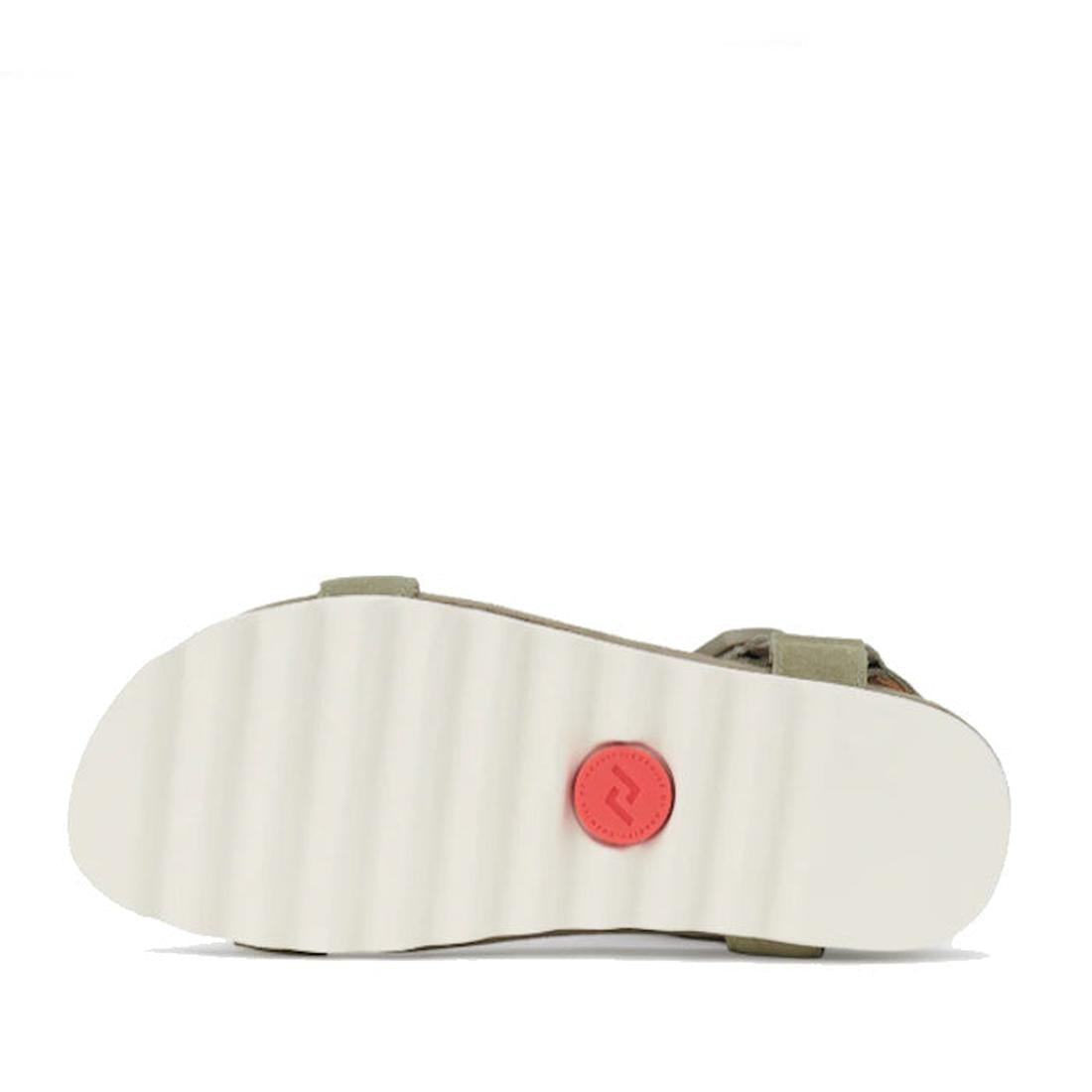 The image displays the bottom view of the Rollie Womens Sandal Tooth Wedge Sage/White, featuring an EVA sawtooth wedge outsole with a red circular logo by the heel. Partially visible adjustable sheep leather straps appear against a plain white background.