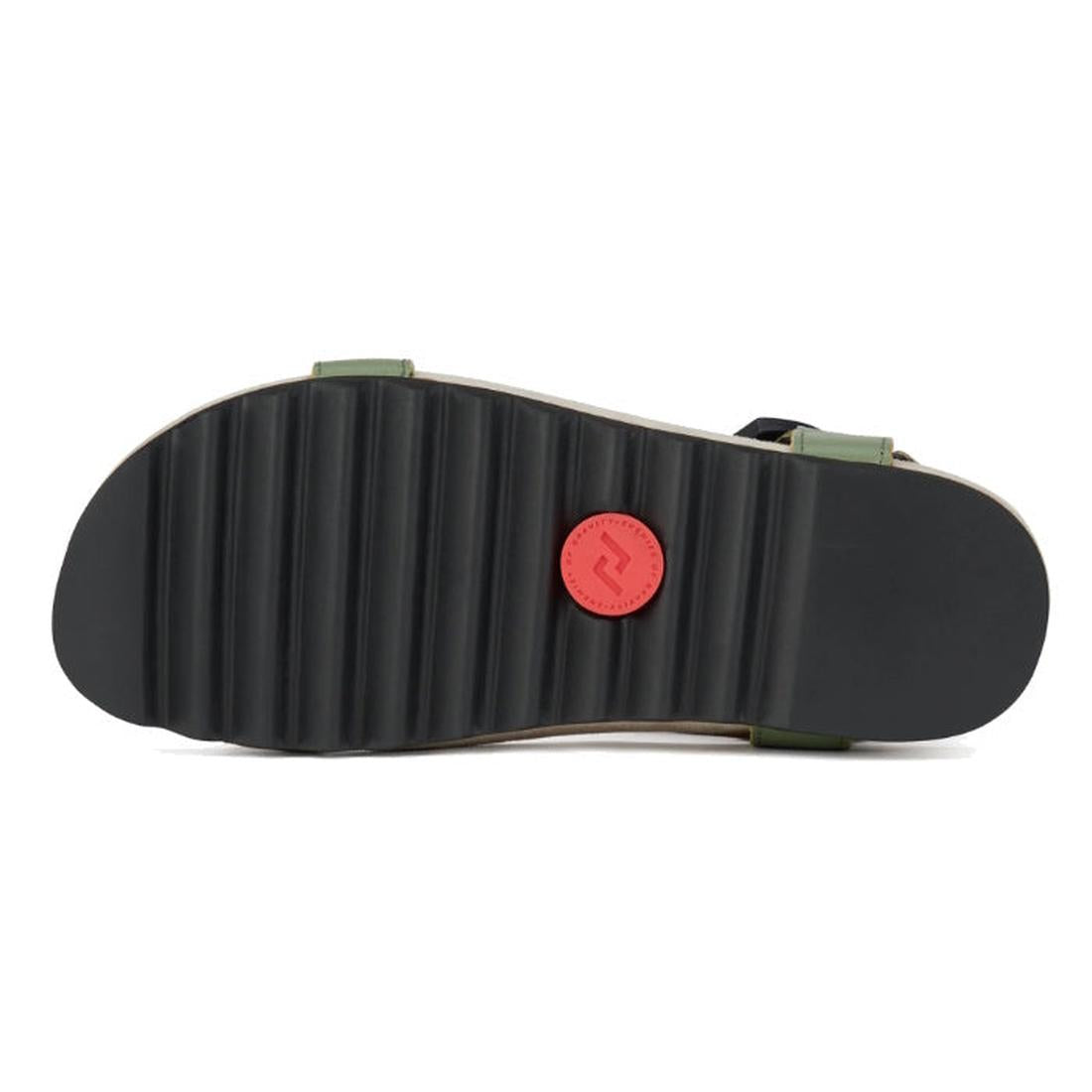 The image displays the black ridged EVA outsole of the Rollie Womens Sandal Tooth Wedge Trail Green Brown, featuring a round red logo near the center and hints of green adjustable leather straps along the edges., 48166, 9781760794064, 9781760794071, 97817