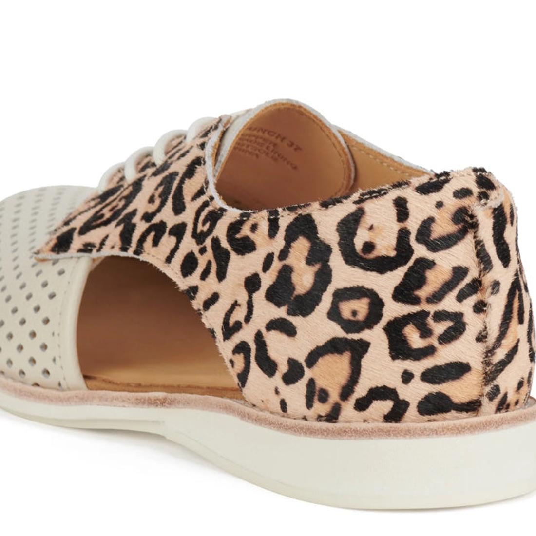 Close-up of the Rollie Womens Sidecut Punch Bone Leather Leopard Cut Out Brogue showing beige punch hole front, tan faux fur with black and brown leopard print at the back, white sole, lace-up design, and breathable linings., 9339554303413, 9339554303420,
