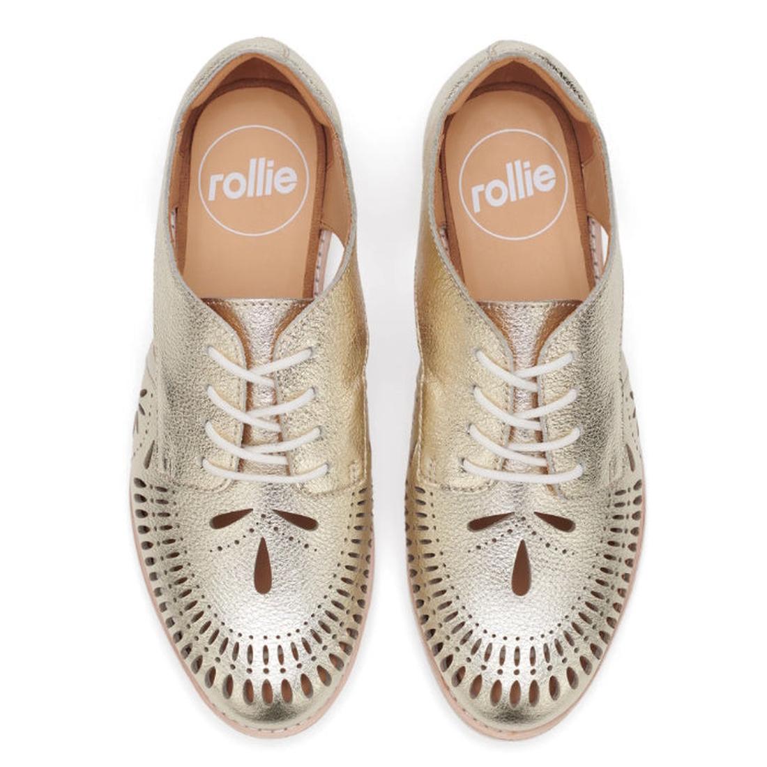 Top view of the Rollie Womens Sidecut Boho Punch Gold Leather Shoe: gold brogue lace-ups with decorative cutouts, white soles, comfy memory foam footbed, and tan insoles branded “rollie” in white., 9381760798811, 9381760798828, 9381760798835, 938176079884
