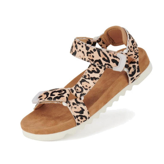 The Rollie Womens Sandal Tooth Wedge Neutral Leopard features an open toe, beige and black leopard print, adjustable leather straps, tan suede-wrapped footbed, and a white textured sole. Displayed on a white background.