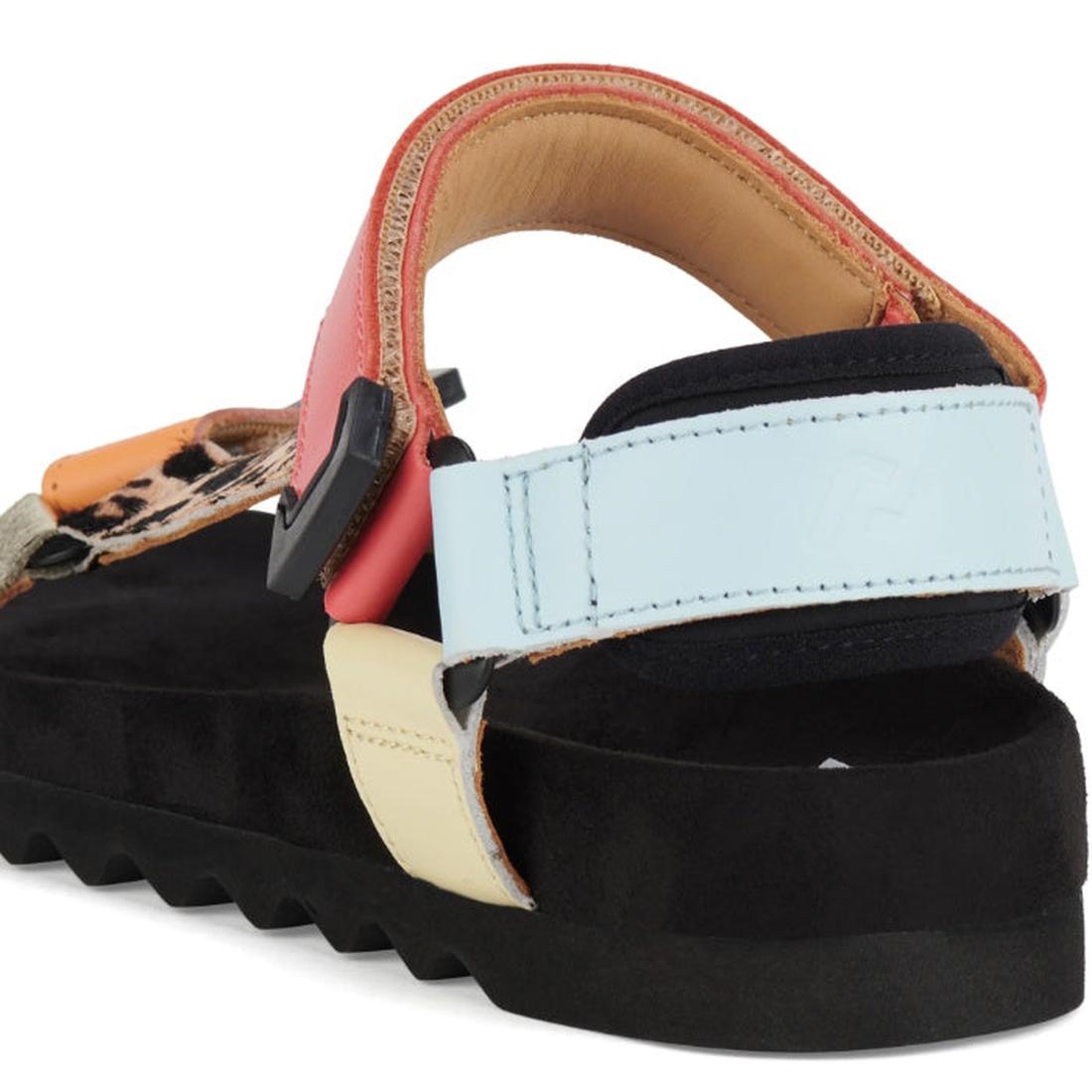A close-up of the Rollie Womens Sandal Tooth Wedge Leopard Multi, featuring a thick black sole, pastel blue and yellow adjustable leather back straps, pink side strap, leopard print front strap, and a comfy suede footbed., 9339554333786, 9339554333793, 93