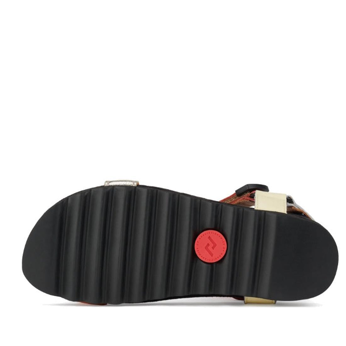 The image shows the bottom view of the Rollie Womens Sandal Tooth Wedge Leopard Multi, featuring a black ridged rubber sole with a red circular logo near the heel, adjustable leather straps, and visible side hardware., 9339554333786, 9339554333793, 933955