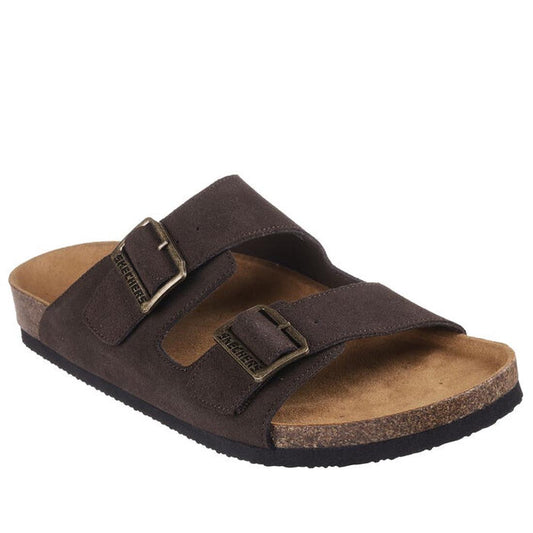 The Skechers Men's Aidan Leelan Arch Fit Sandal in chocolate brown features a relaxed fit, two adjustable buckle straps, cork footbed, and black sole, shown on a white background.