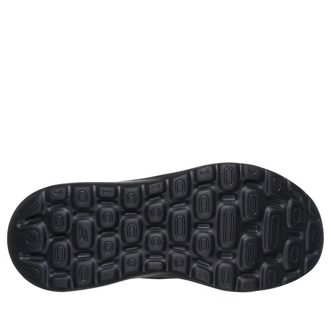 Close-up of the black textured sole on the Skechers Womens Slip In Go Walk Arch Fit N-Joy Black, featuring raised oval grips and indentations for traction with Arch Fit support., 199025170253, 49932, 199025170277, 49934, 199025170291, 49936, 199025170314,