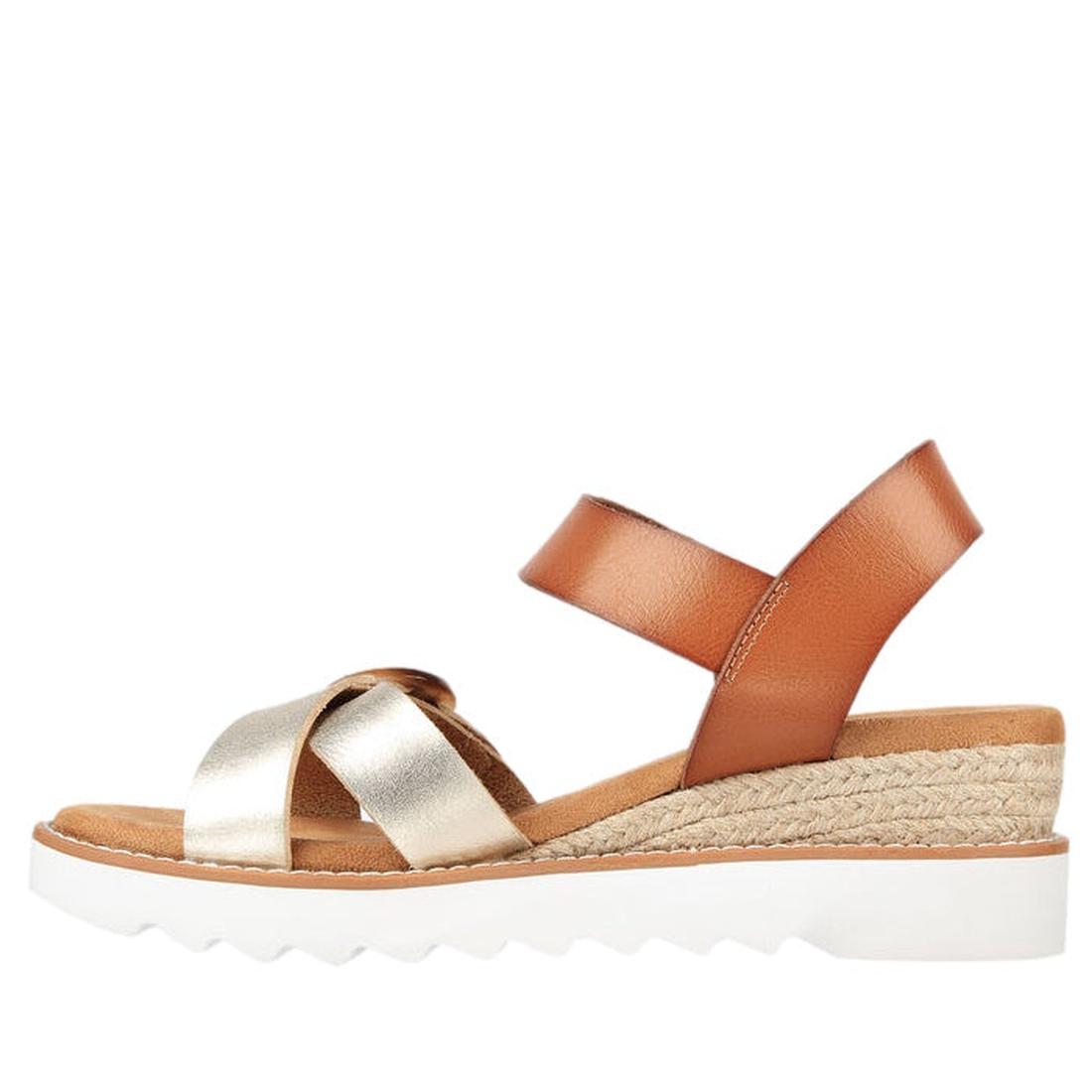 The Skechers Bobs Women's Desert Kiss Hi Divine Garden Champagne Tan sandal features tan and metallic gold straps, a tan ankle strap, woven jute wedge heel, white ridged rubber sole, and cushioned memory foam footbed on a white background., 195969581407, 