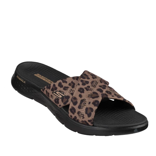 The Skechers GO WALK Flex Sandal Kat Slide in Black Leopard features a crisscross fabric strap in a black leopard print design, a contoured Memory Foam footbed for added comfort, and Skechers branding displayed on the upper strap.