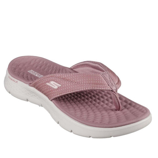 The Skechers Go Walk Flex Sandal Impress Slide in mauve features a textured footbed, thick white sole, and a fabric vegan strap with the “S” logo for comfort and style.