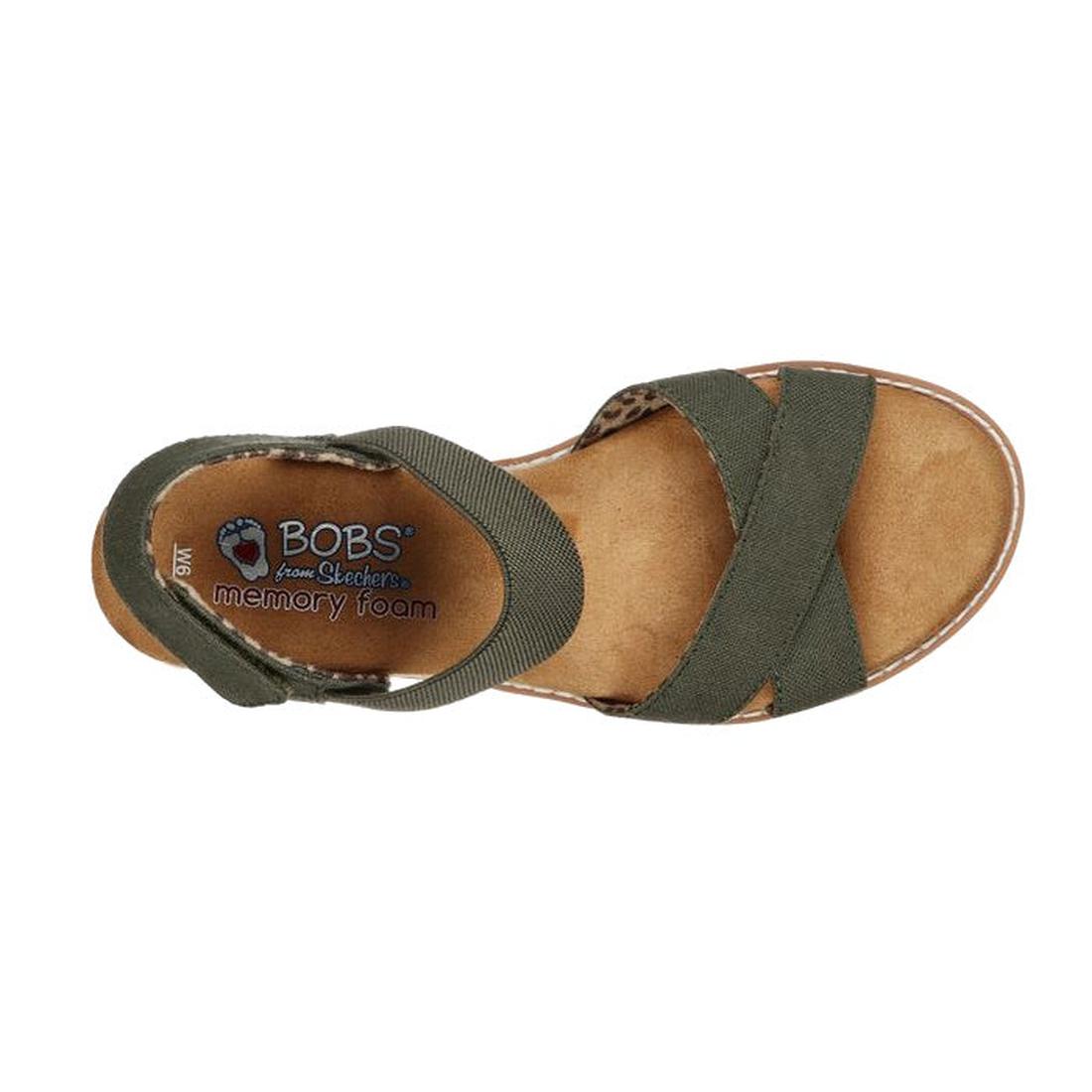 A top view of the Skechers Bobs Womens Desert Kiss Secret Picnic Wedge Sandal in olive, featuring crisscross fabric straps, an ankle strap, and a tan cushioned Memory Foam footbed., 194428807249, 194428807256, 194428807263, 194428807270, 194428807287, 408