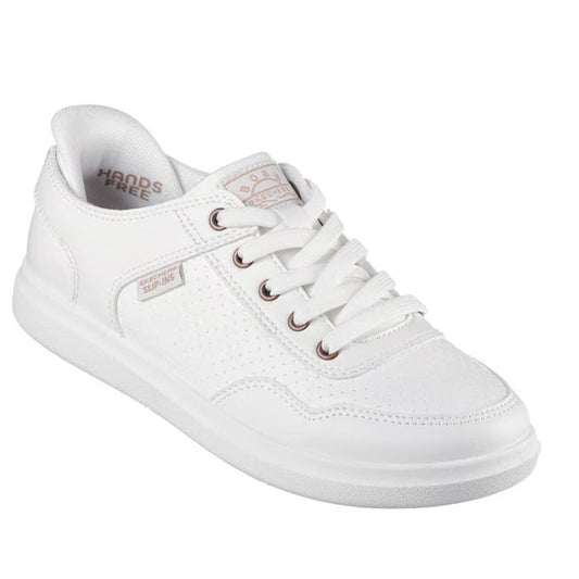 Right foot showing front and side view of a Skechers Bobs Slip DvIne So Flattered Wide Width White sneaker with visible brand logo on a white background. The laces are for extra fitting adujsument but the shoes can be slipped on.