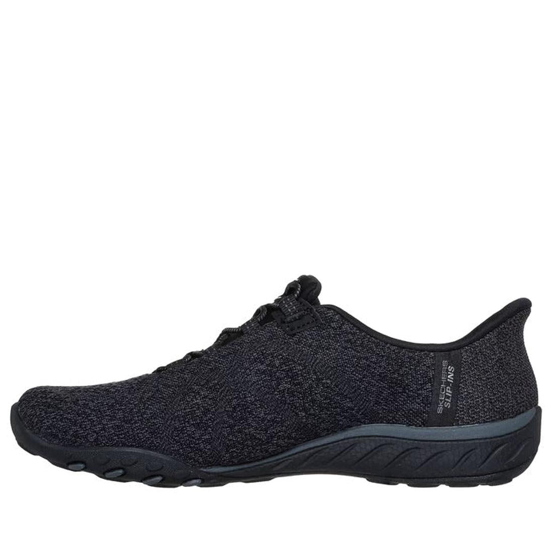 The Skechers Breathe Easy Knitty Waves SLIP IN Black is a slip-on athletic shoe with a textured fabric upper, low profile, black rubber sole, Stretch Fit, and Air-Cooled Memory Foam, shown in side view on a white background., 198376792176, 198376792190, 1