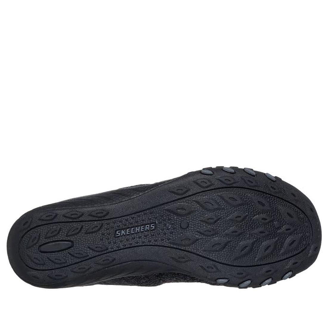 The image shows the black rubber outsole of the Skechers Breathe Easy Knitty Waves SLIP IN, featuring a textured tread pattern and the SKECHERS logo in the center—part of the Hands Free Slip-ins collection., 198376792176, 198376792190, 198376792213, 19837