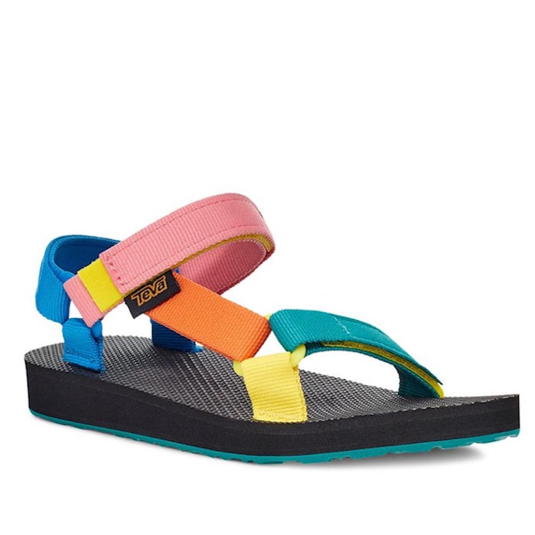 The Teva Kids - K Original Universal C 90s Sandal Multi features adjustable quick-dry straps in blue, pink, orange, yellow, and teal with a black sole and logo. Made from recycled plastics for colorful, eco-friendly play.