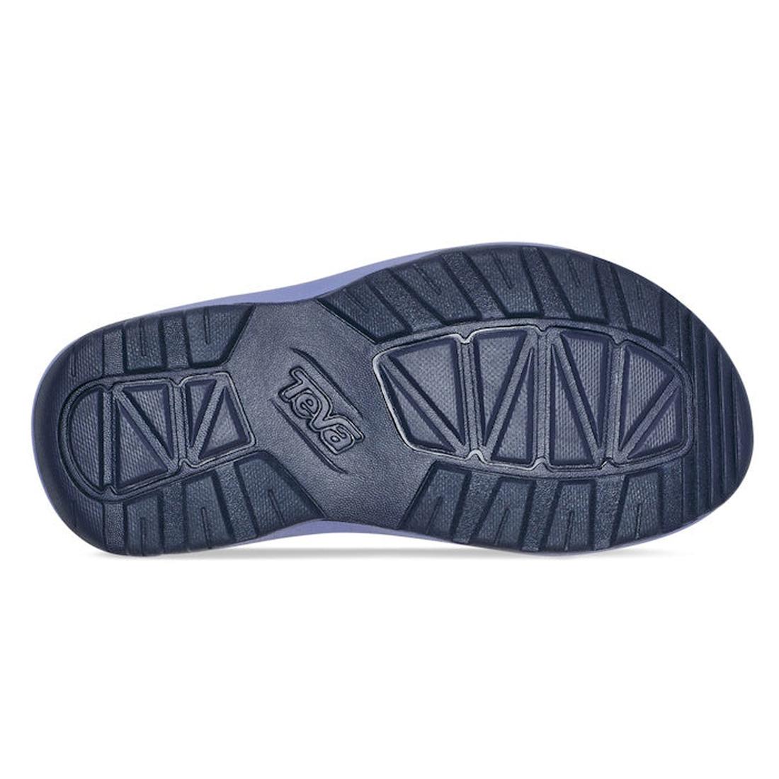 The image shows the sole of the Teva Kids K Hurricane XLT2 Waves Pastel Lilac Purple, featuring a dark, textured tread with “Teva” embossed in the center. Made with vegan-friendly materials and recycled plastic webbing for superior grip., 196565099822, 19