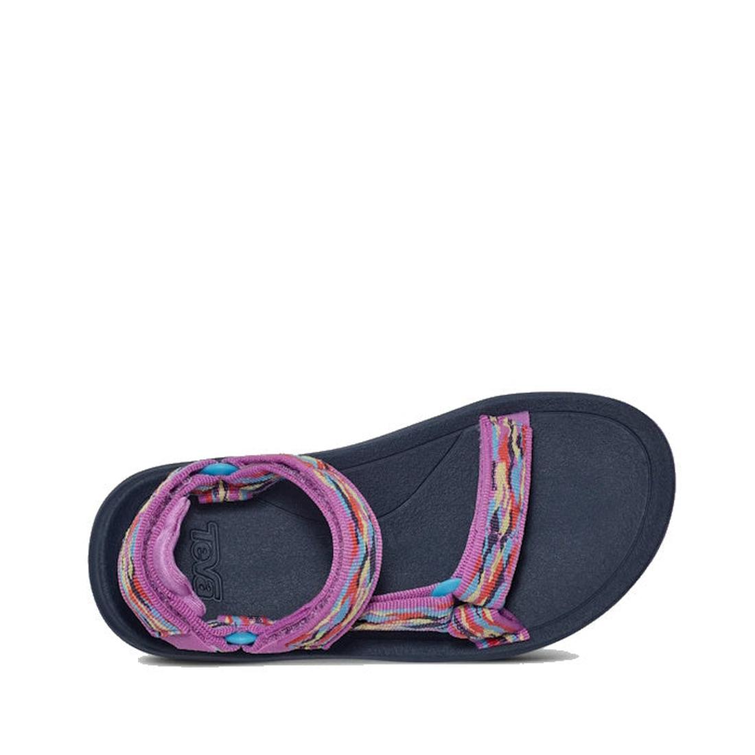 The Teva Kids K Hurricane XLT2 Girls Active Sandal in purple features a textured sole, colorful woven straps, an open toe, and an adjustable ankle strap. This vegan sandal is designed for comfort and style., 196565921765, 196565921819, 196565921789, 19656