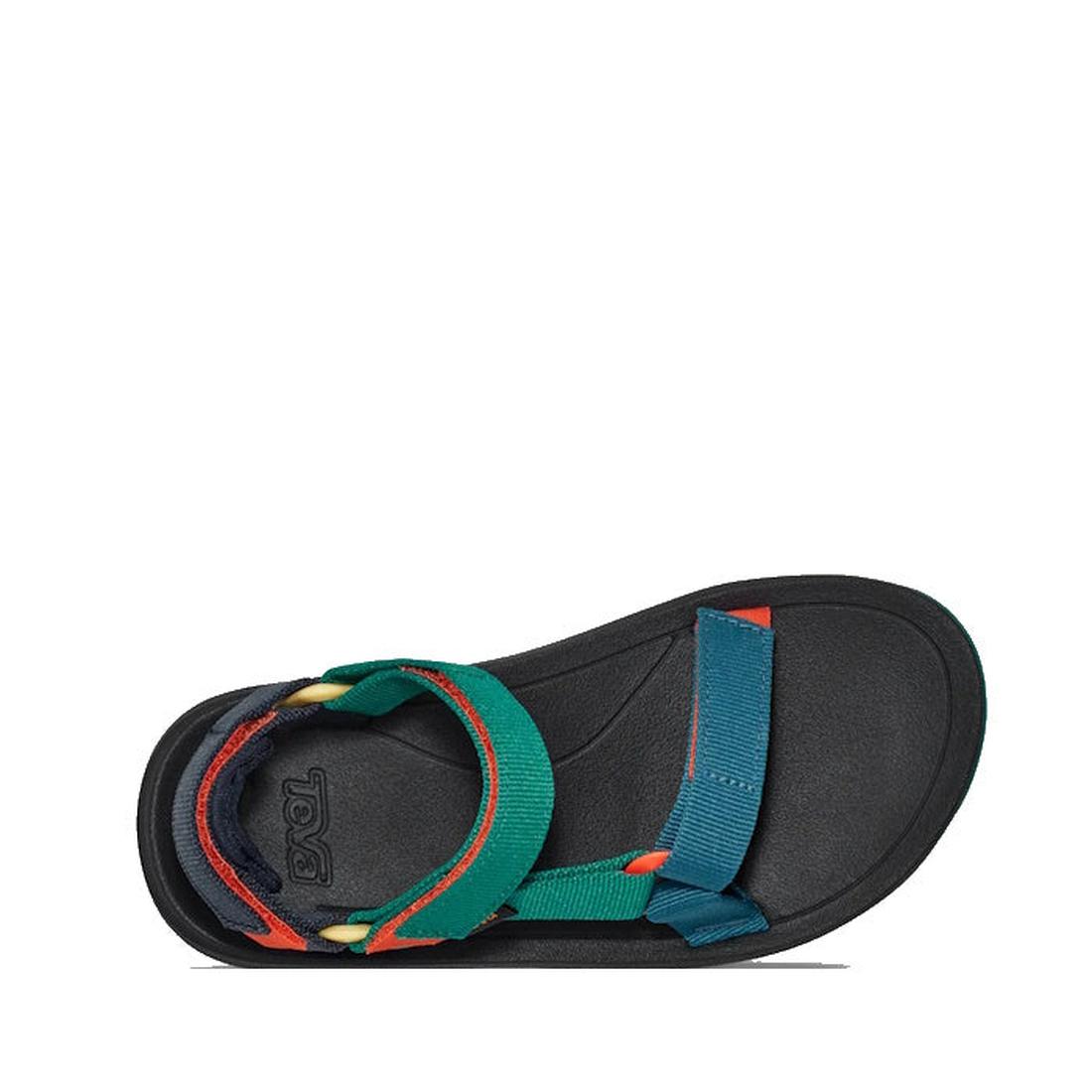 A single Teva Kids - K Hurricane XLT2 sandal in Black Teal Multi, with a black sole and colorful recycled nylon straps in teal, green, red, and yellow. Open toe style with a hook-and-loop ankle strap, viewed from above on white., 196565921550, 19656592156