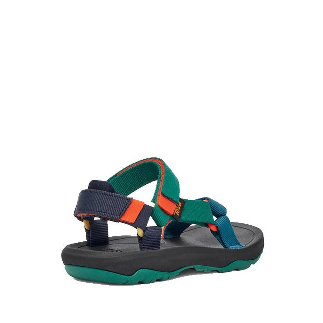 The Teva Kids K Hurricane XLT2 Black Teal Multi features green, blue, orange, and black straps, an open heel design, and a green-black cushioned sole made from recycled materials. The sandal is shown angled on a plain white background., 196565921550, 1965