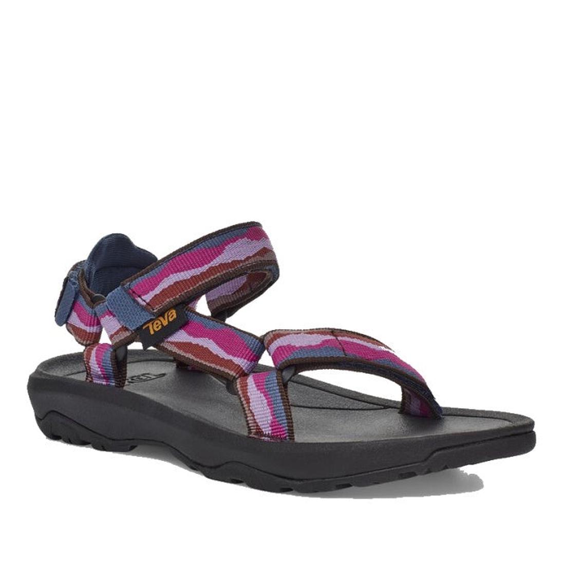 A single Teva Kids - K Hurricane XLT2 Girls Active Sandal with a black sole and adjustable straps in purple, pink, and red camo. Features a yellow Teva logo on the side strap and is made with recycled materials—ideal for hiking adventures.