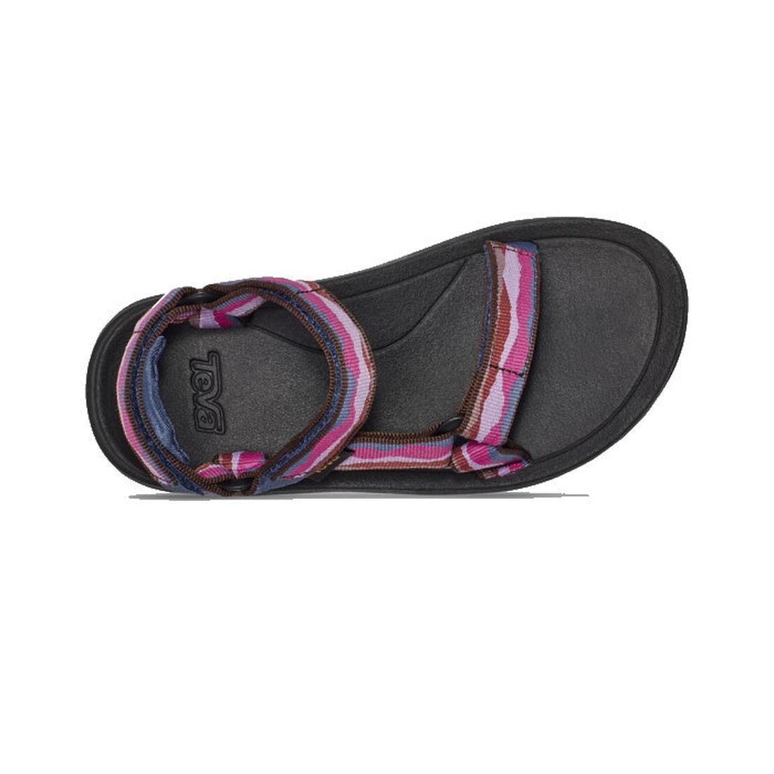 The Teva Kids - K Hurricane XLT2 Girls Active Sandal is black with a thick sole and colorful striped fabric straps in purple, pink, red, and blue shades made from recycled materials, shown flat with a top-down view., 194715400955, 194715401006, 1947154009