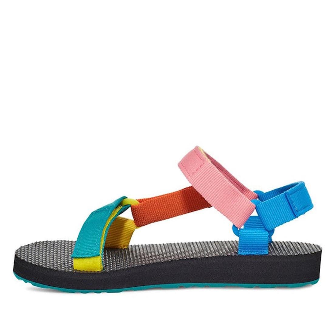 The Teva Kids - K Original Universal C 90s Sandal Multi features a black sole, textured footbed, and quick-dry adjustable straps in teal, yellow, orange, pink, and blue. Shown from the side on a white background., 194715572362, 194715572379, 194715572386,