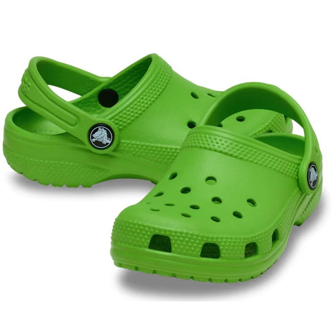 A pair of Crocs Kids Toddlers Classic Clog in bright green, featuring ventilation holes, adjustable heel straps, and textured soles, shown slightly overlapping on a white background.