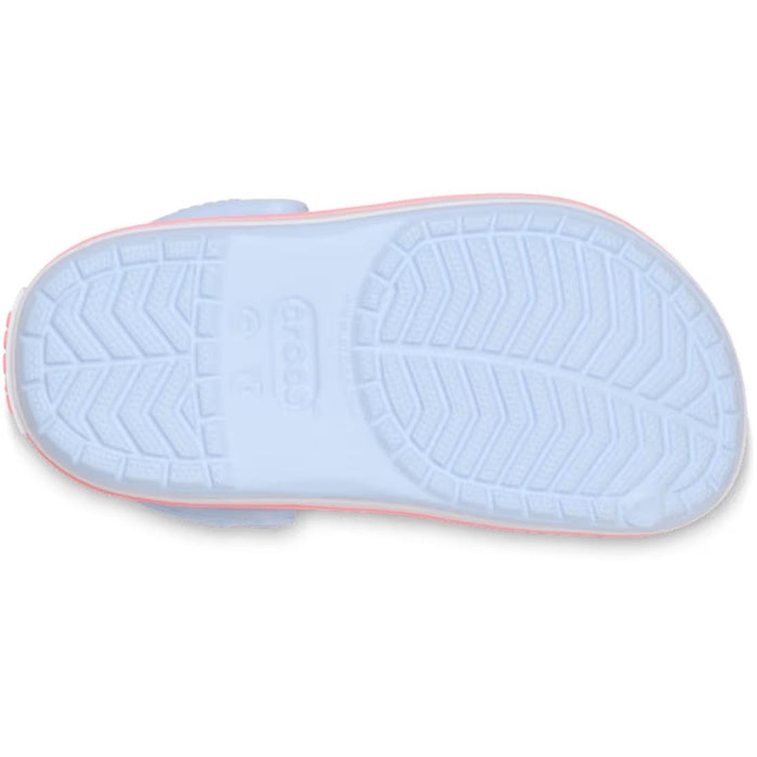 The image shows the Frost Blue sole of the Crocs Kids - Crocband Classic Clog Frost Blue Guava Youths, featuring a textured tread for grip, "Crocs" embossed in the center, and a thin pink outline around the Croslite material., 49854, 49855, 49856, 49857, 