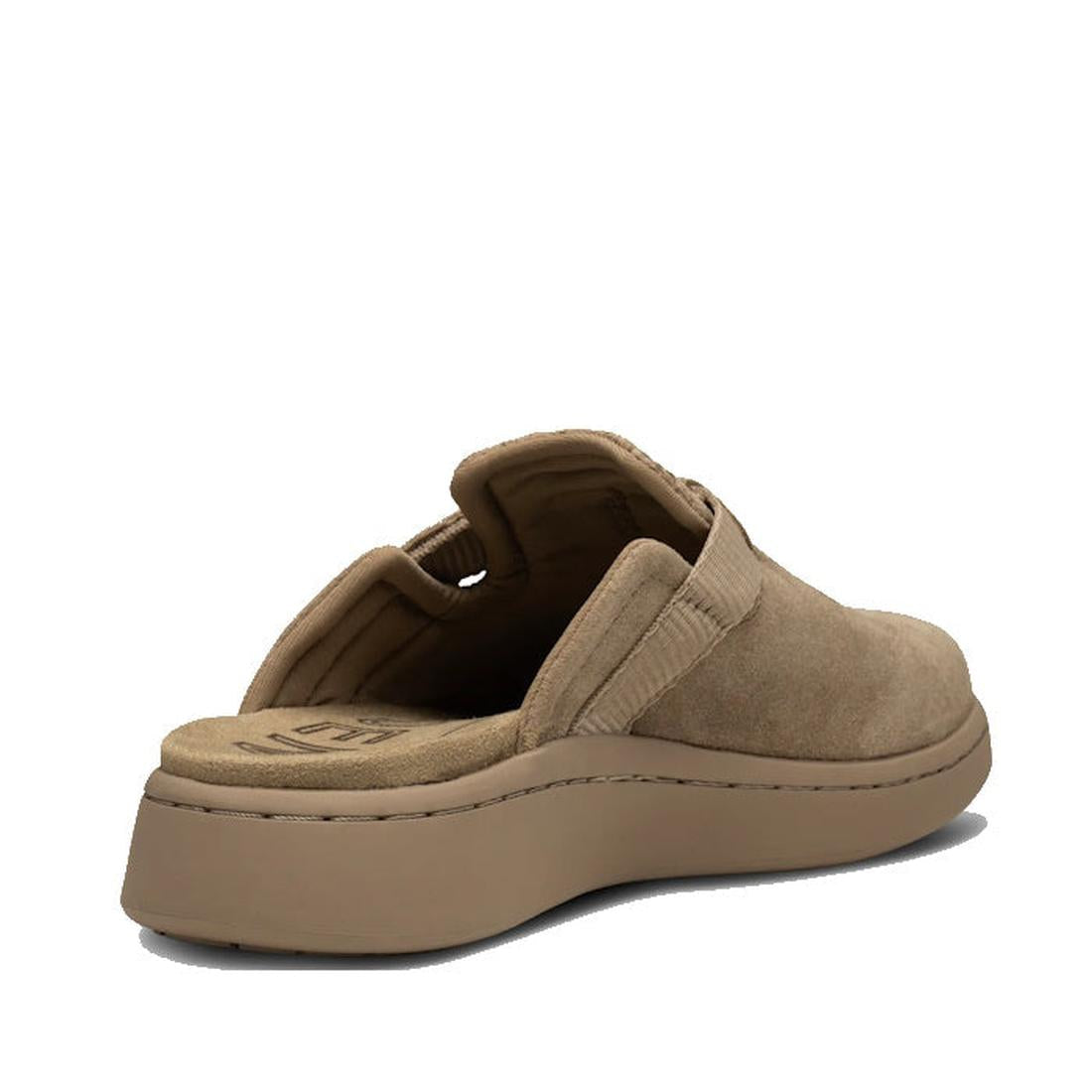The Woden Womens Vega Clog Suede Mule in Silver Mink (Beige) features a suede upper, cushioned sole, and open back. Seen from a rear side angle on a white background, it includes Natural Soft Technology for all-day comfort., 42722, 5713326514100, 57133265