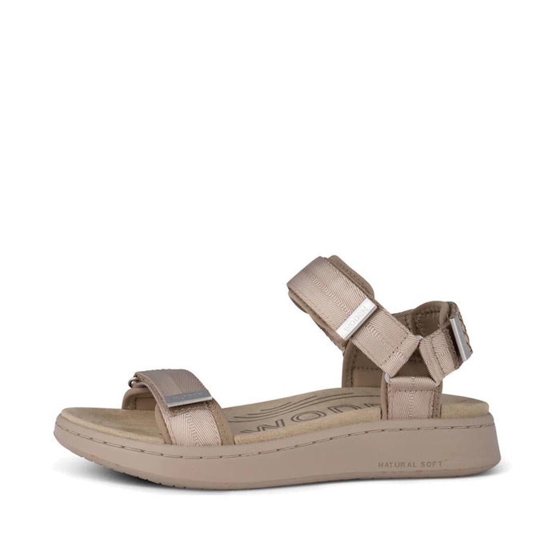 The Woden Line Women's 3 Strap Sandal in Silver Mink features adjustable ankle and toe straps, a cushioned insole, and a slightly raised sole. Ideal for everyday wear or sightseeing, these sandals blend comfort with casual style.