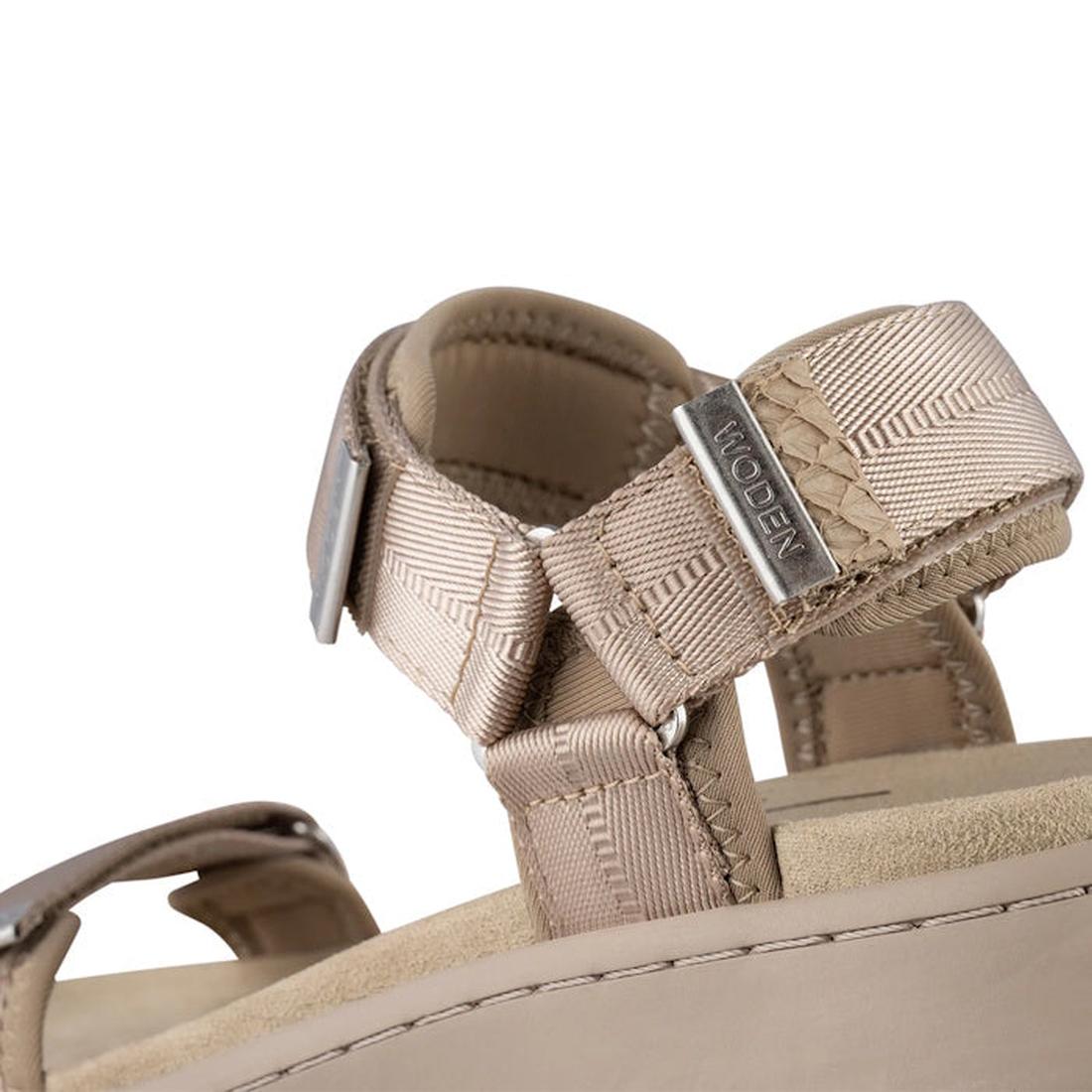 Close-up of the Woden Line Women's 3 Strap Sandal in Silver Mink, featuring beige cushioned comfort, adjustable nylon straps with a metal buckle, and a small metal tag engraved with the Woden brand name., 48203, 48204, 5713326605235, 5713326605242, 571332
