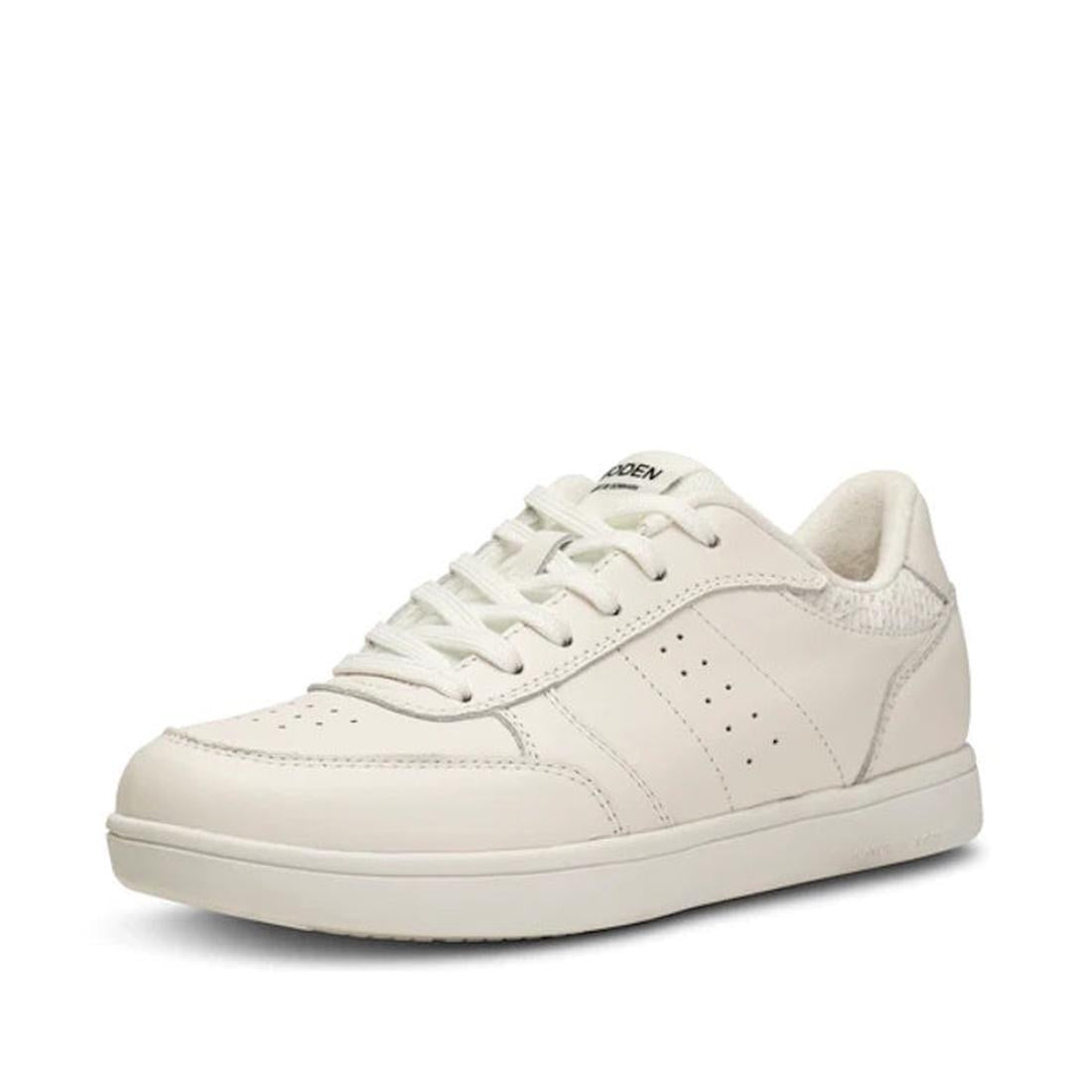 The Woden Bjork Women's Leather Sneaker in Blanc de Blanc White features a sustainable low-top design, lace-up closure, and subtle side perforations, shown against a plain white background.