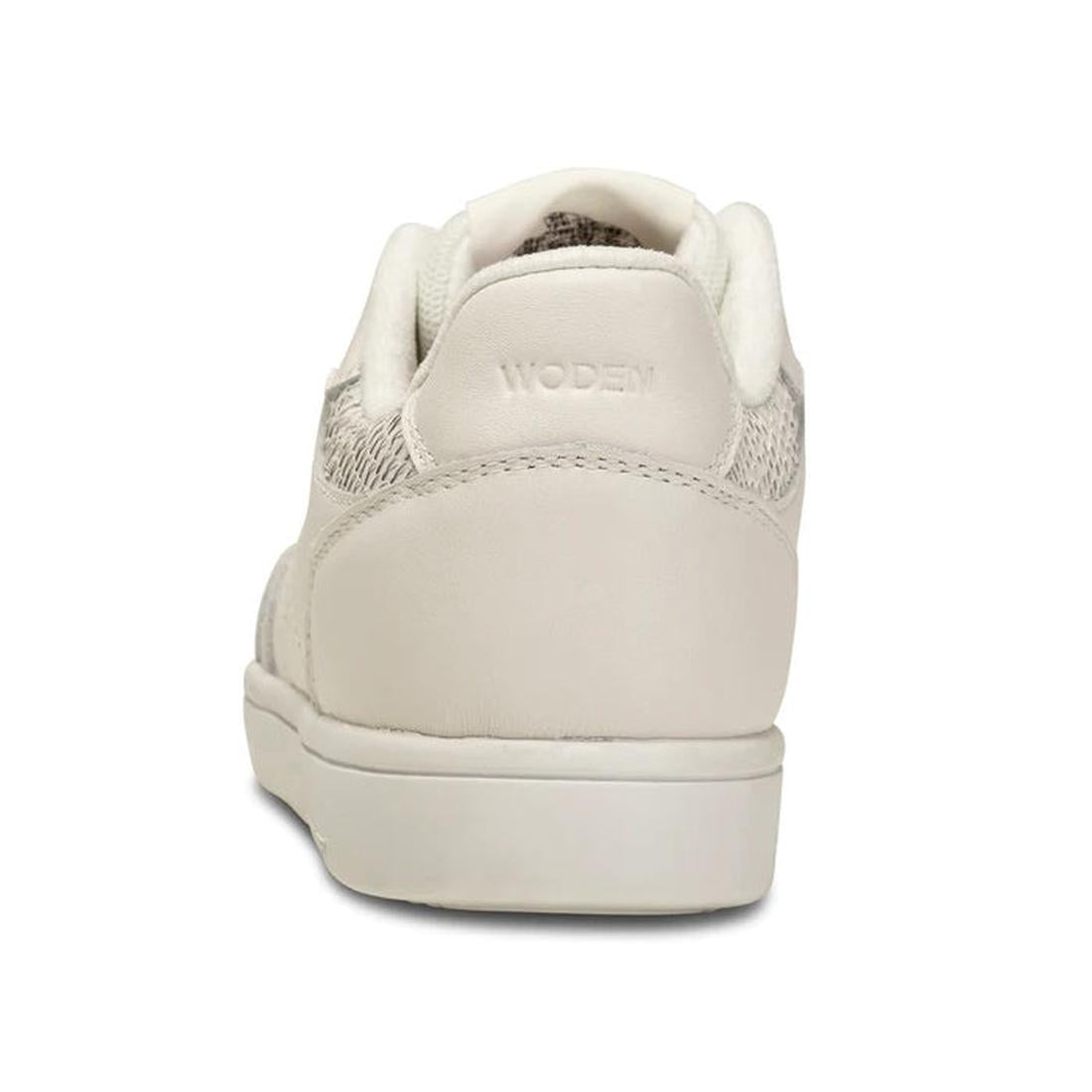 A close-up rear view of the Woden Bjork Women's Leather Sneaker Blanc de Blanc White, featuring textured fabric details and "WODEN" embossed on the heel, showcases these sustainable sneakers against a plain white background., 5713326460865, 5713326460872,
